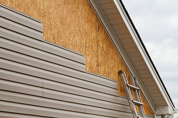 Professional Storm Damage Siding Repair technician working in Broadway, NC
